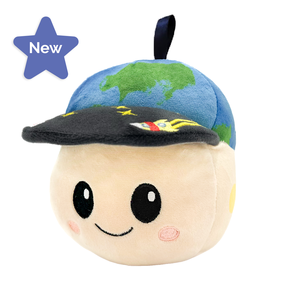 A plush toy shaped like a round beige face wearing a blue and green globe cap, shown on a white background.